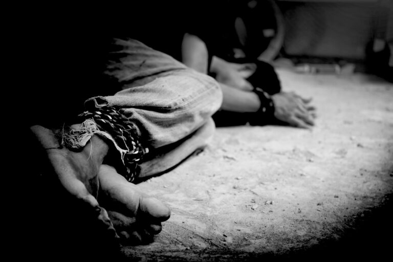 human trafficking, hands tied together with rope